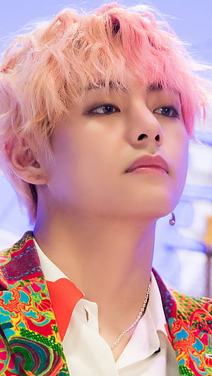 Kim Taehyung of BTS with pink hair and colorful patterned jacket HD phone wallpaper