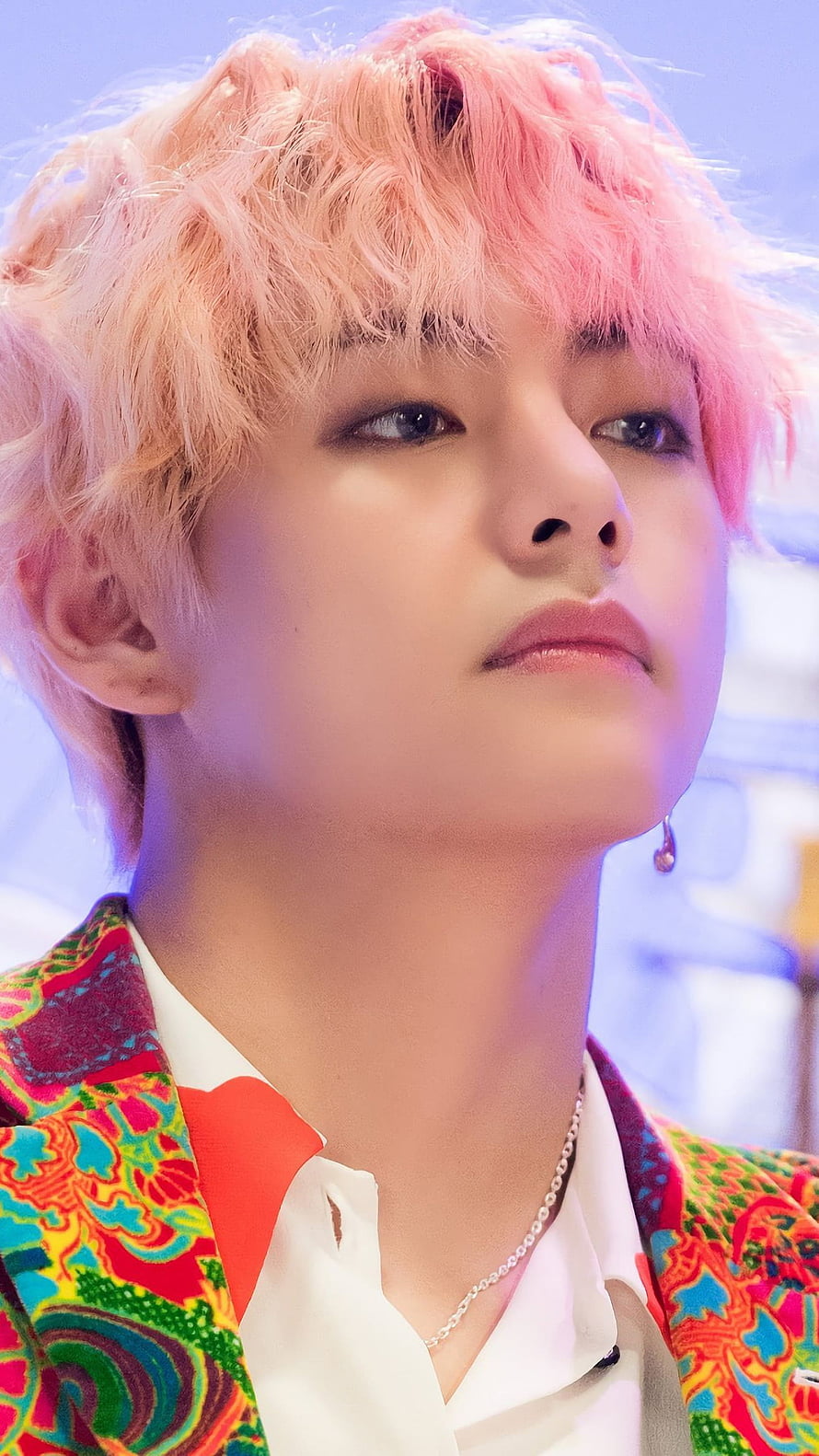 Kim Taehyung of BTS with pink hair and colorful patterned jacket HD phone wallpaper