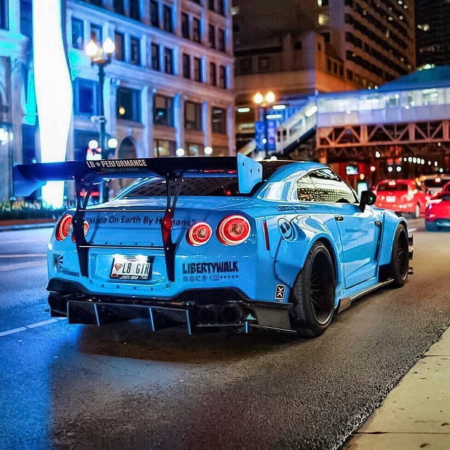 Liberty Walk Nissan GT-R Widebody in Blue on a City Street at Night HD phone wallpaper
