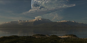 Star Wars Imperial Star Destroyer hovering over a mountainous planet with a large moon in the sky HD wallpaper