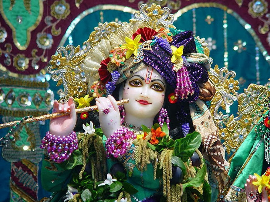 Ornate Radha Krishna Murti with Flute and Floral Garland in Temple Setting HD wallpaper