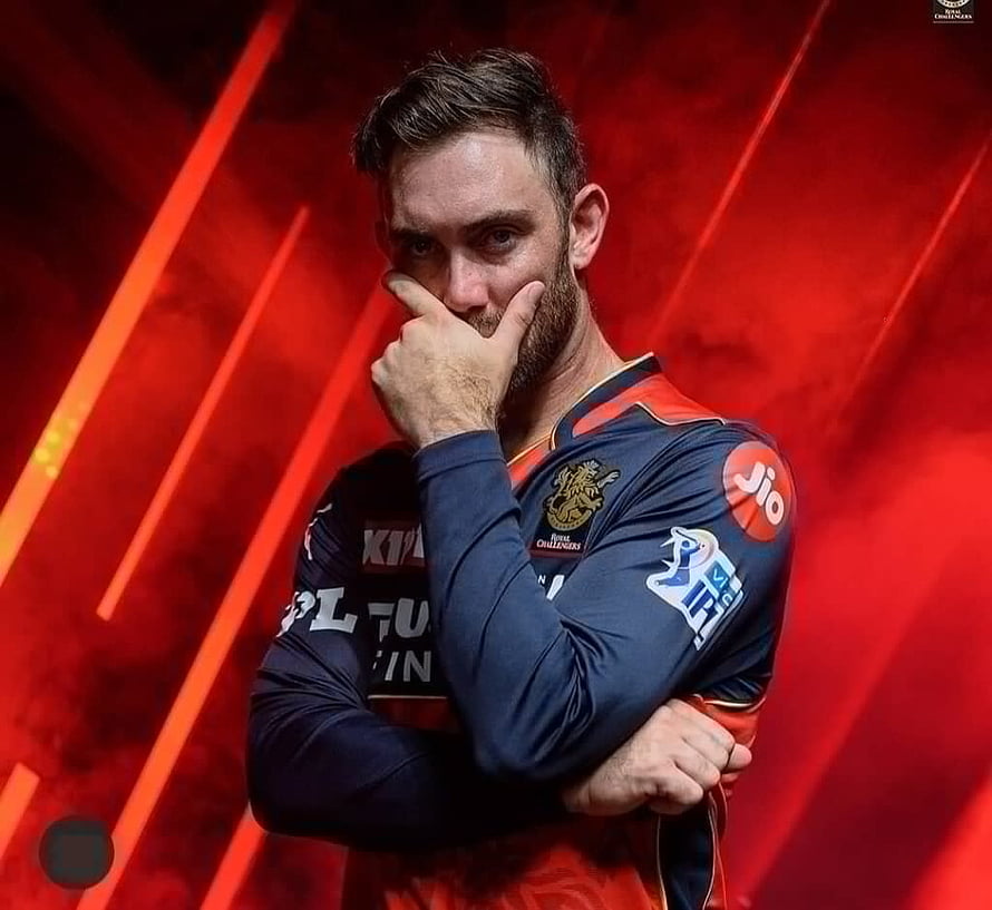 Glenn Maxwell in Royal Challengers Bangalore Jersey with Red Stadium Background HD wallpaper