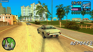 GTA Vice City Stories gameplay screenshot featuring a white muscle car driving through a sunny tropical city street HD wallpaper