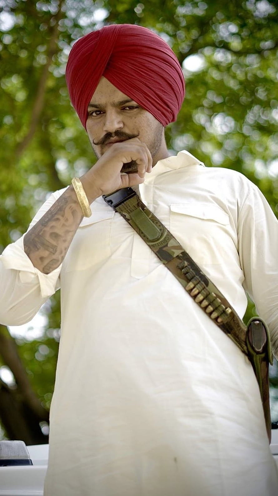 Sidhu Moose Wala in Red Turban and White Kurta with Camouflage Bandolier HD phone wallpaper