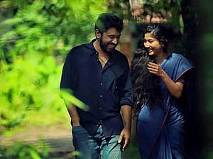 Sai Pallavi and Nivin Pauly in a romantic outdoor scene from the film Premam HD wallpaper