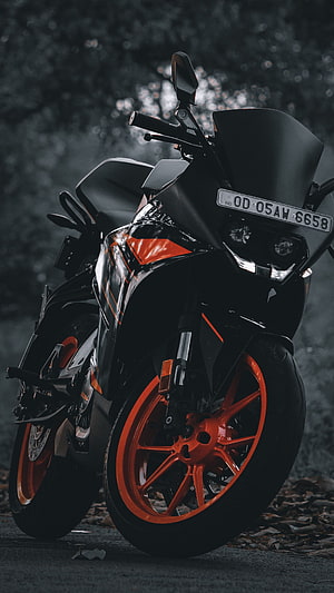 Black and Orange KTM Sport Bike with Aggressive Front Fairing and Alloy Wheels HD phone wallpaper