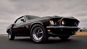 Black 1967 Ford Mustang Fastback Classic Muscle Car on Overcast Day HD wallpaper