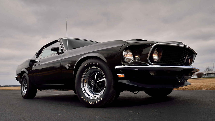 Black 1967 Ford Mustang Fastback Classic Muscle Car on Overcast Day HD wallpaper