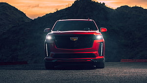 Red Cadillac Escalade V Front View at Sunset with Mountain Silhouette HD wallpaper