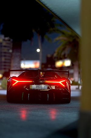 Lamborghini Veneno Rear View with Glowing Taillights at Night HD phone wallpaper