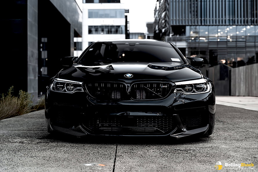 Black BMW M5 F90 Front Facade in Urban Setting HD wallpaper