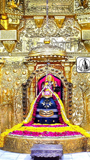 Somnath Mahadev Temple Idol Adorned With Marigold Garlands And Golden Canopy HD phone wallpaper