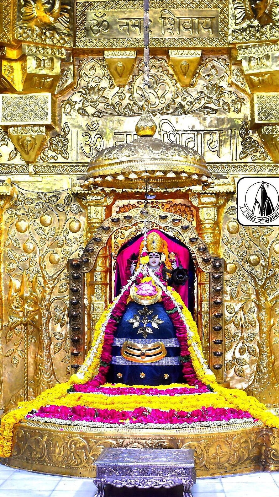 Somnath Mahadev Temple Idol Adorned With Marigold Garlands And Golden Canopy HD phone wallpaper
