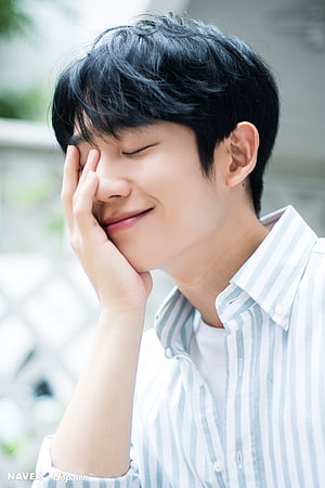 Jung Hae In smiling with eyes closed in a light striped shirt HD phone wallpaper