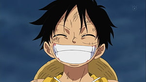 Luffy from One Piece Smiling Broadly with a Battle-Scarred Face HD wallpaper