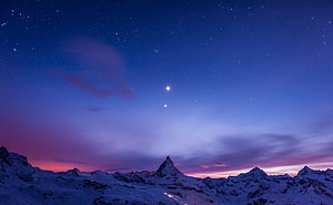 Matterhorn Peak Under a Starry Night Sky with Vibrant Twilight Hues HD wallpaper