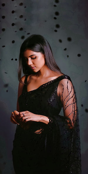Kalyani Priyadarshan in Elegant Black Sequined Gown with Dramatic Studio Lighting HD phone wallpaper