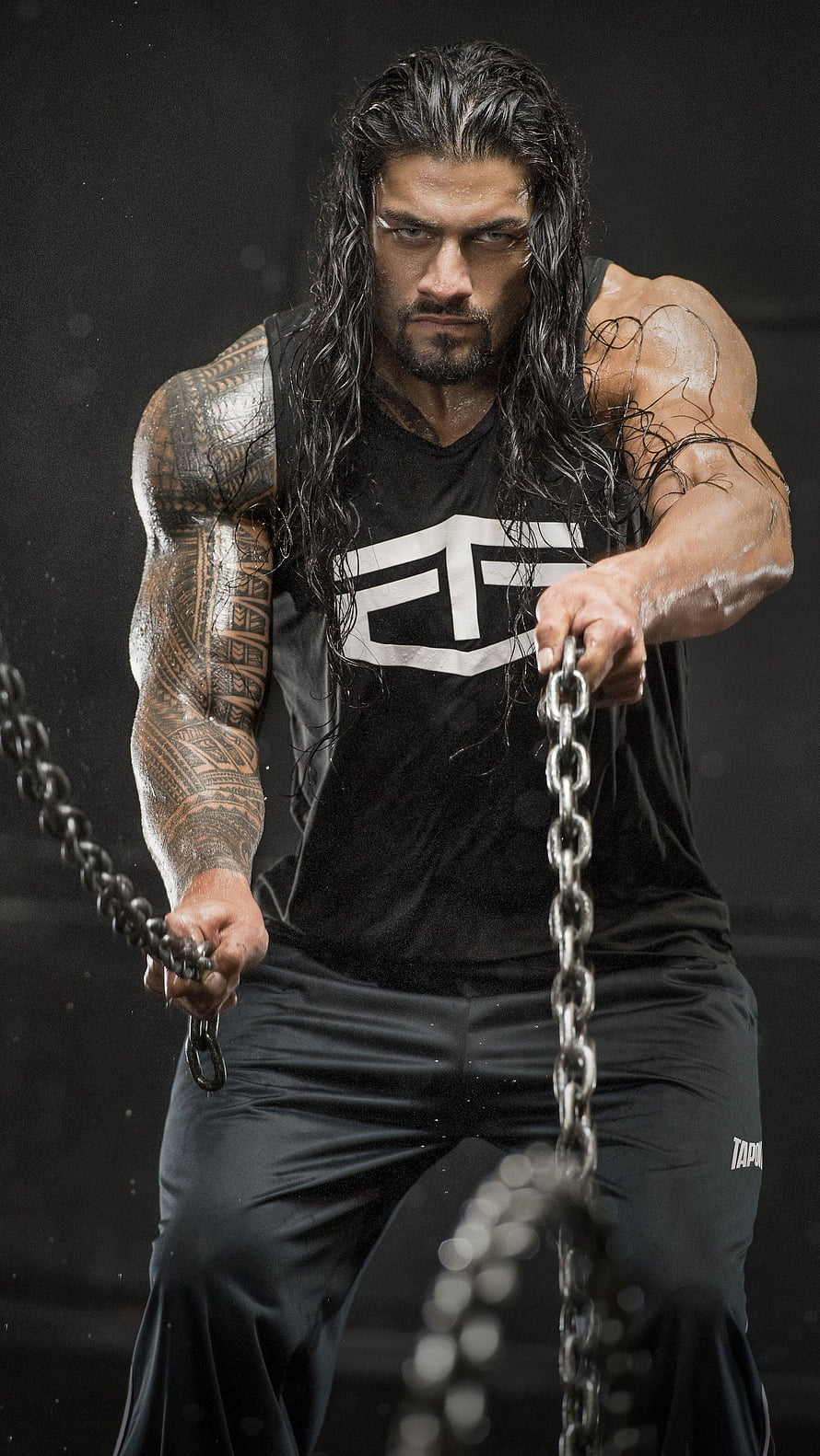 Roman Reigns WWE Superstar Intense Portrait with Chains and Tribal Tattoos HD phone wallpaper