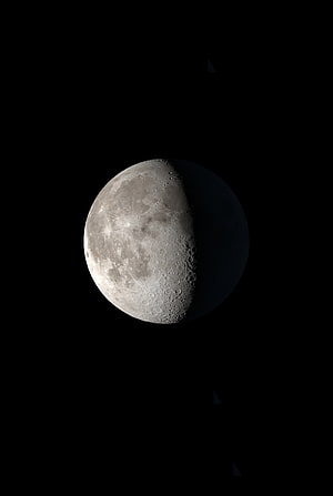 Gibbous Moon with Cratered Surface Against Deep Black Space HD phone wallpaper