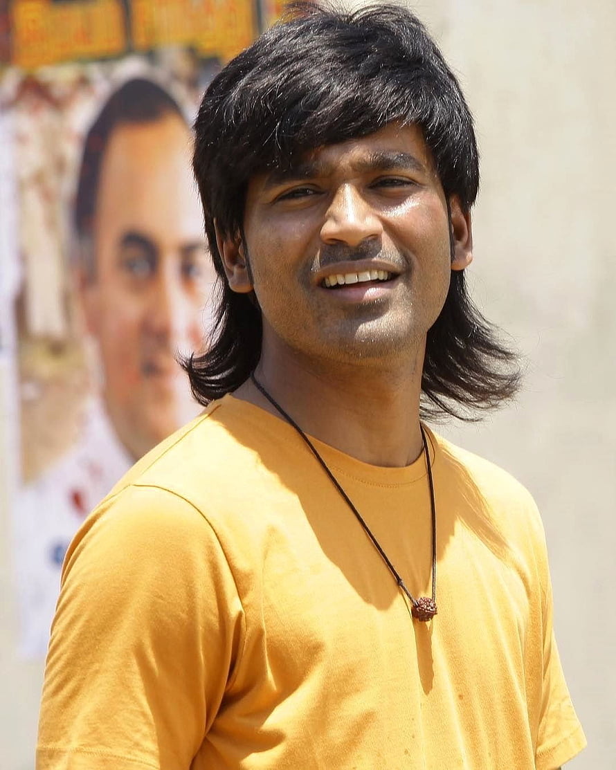 Dhanush in Vada Chennai wearing a yellow t-shirt and beaded necklace HD phone wallpaper