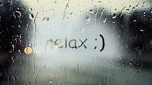 Rainy Day Window with Relax Message and Water Droplets on Glass HD wallpaper