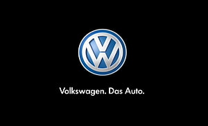 Volkswagen Emblem on Black Background with Das Auto Tagline HD wallpaper
