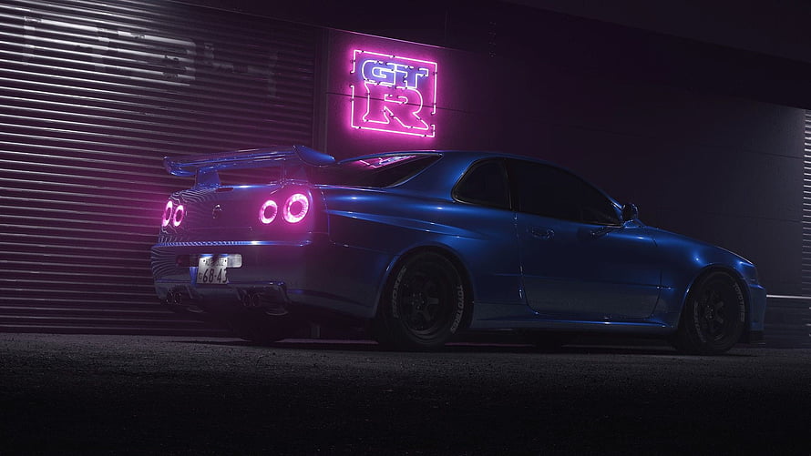 Blue Nissan Skyline R34 GT-R with Neon Pink Taillights in a Dark Garage HD wallpaper