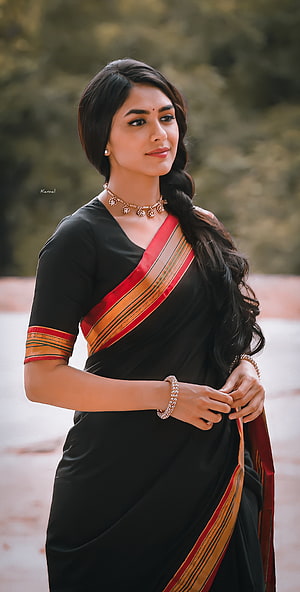 Mrunal Thakur in a Black Saree with Red and Gold Border HD phone wallpaper