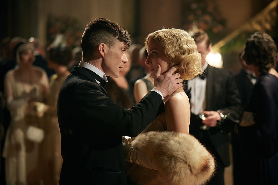 Tommy Shelby and Grace in an intimate moment at a formal 1920s gala event HD wallpaper