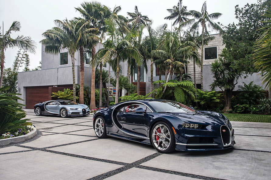 Two Bugatti Chiron Supercars Parked in a Tropical Luxury Estate Driveway HD wallpaper
