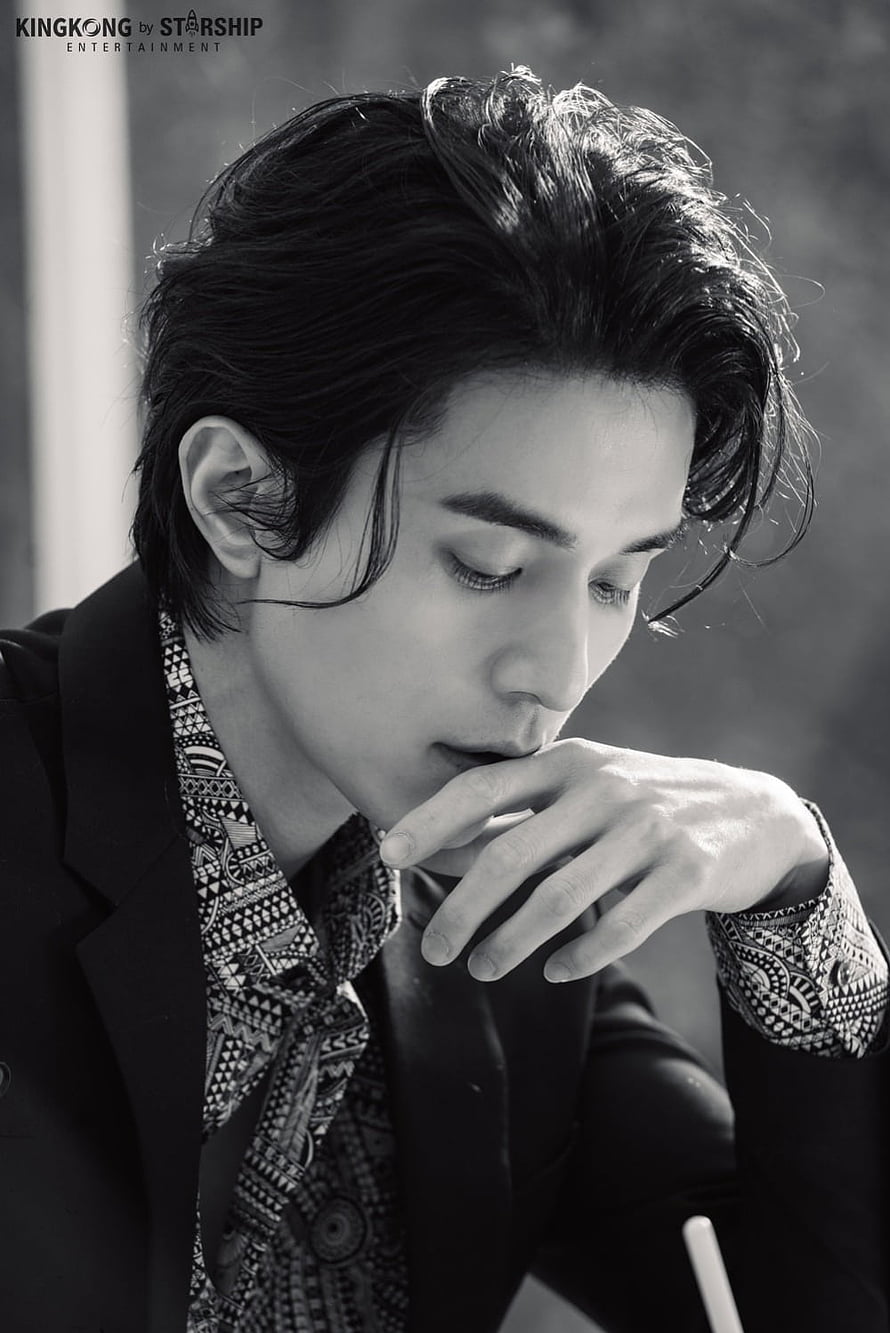 Lee Dongwook in a moody black and white portrait wearing a patterned shirt and dark blazer HD phone wallpaper
