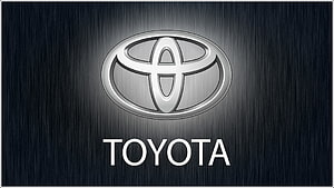 Sleek Toyota Emblem on Dark Brushed Metal Background HD wallpaper