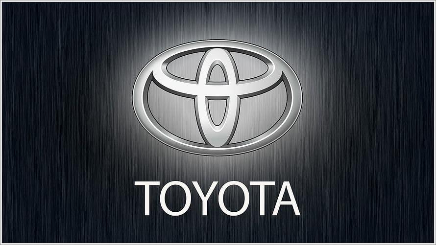 Sleek Toyota Emblem on Dark Brushed Metal Background HD wallpaper