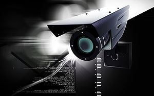 Modern Security Camera with Digital Data Overlay and Dramatic Lighting HD wallpaper