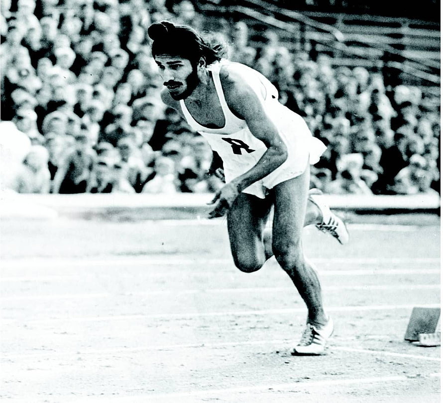 Milkha Singh Sprinting on the Track in a Vintage Black and White Photograph HD wallpaper