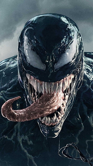 Venom Symbiote Close-Up with Jagged Teeth and Long Tongue Against Dark Stormy Sky HD phone wallpaper
