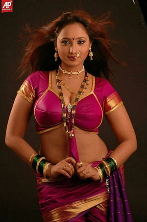 Rani Chatterjee in a vibrant magenta and gold traditional Indian saree with elaborate jewelry HD phone wallpaper