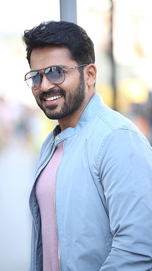 Karthi in Light Blue Jacket and Aviator Sunglasses HD phone wallpaper