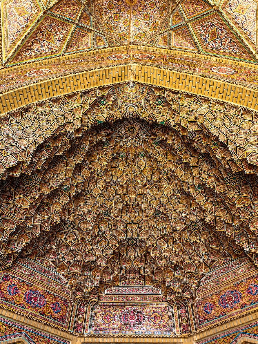 Intricate Muqarnas Vaulting and Floral Tilework in a Persian Mosque Interior HD phone wallpaper