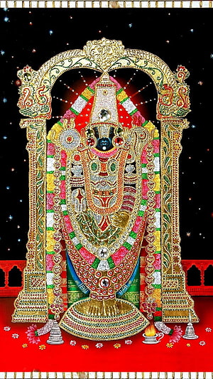 Tirupati Balaji ornate gold and gemstone deity statue with traditional garlands and temple arch HD phone wallpaper