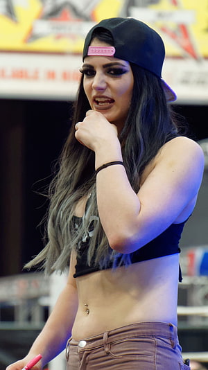Paige WWE Superstar Wrestler in Black Cap and Crop Top at Convention HD phone wallpaper