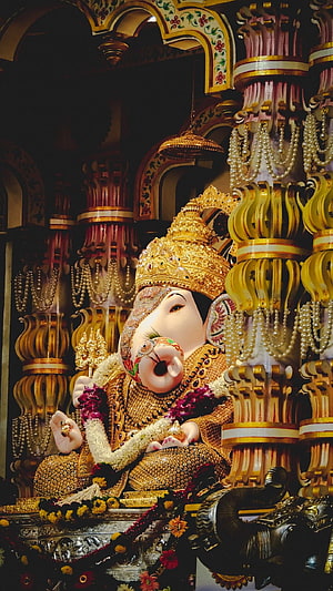 Dagdusheth Ganpati Murti Adorned in Gold Crown and Pearl Garlands Within Ornate Temple Sanctum HD phone wallpaper