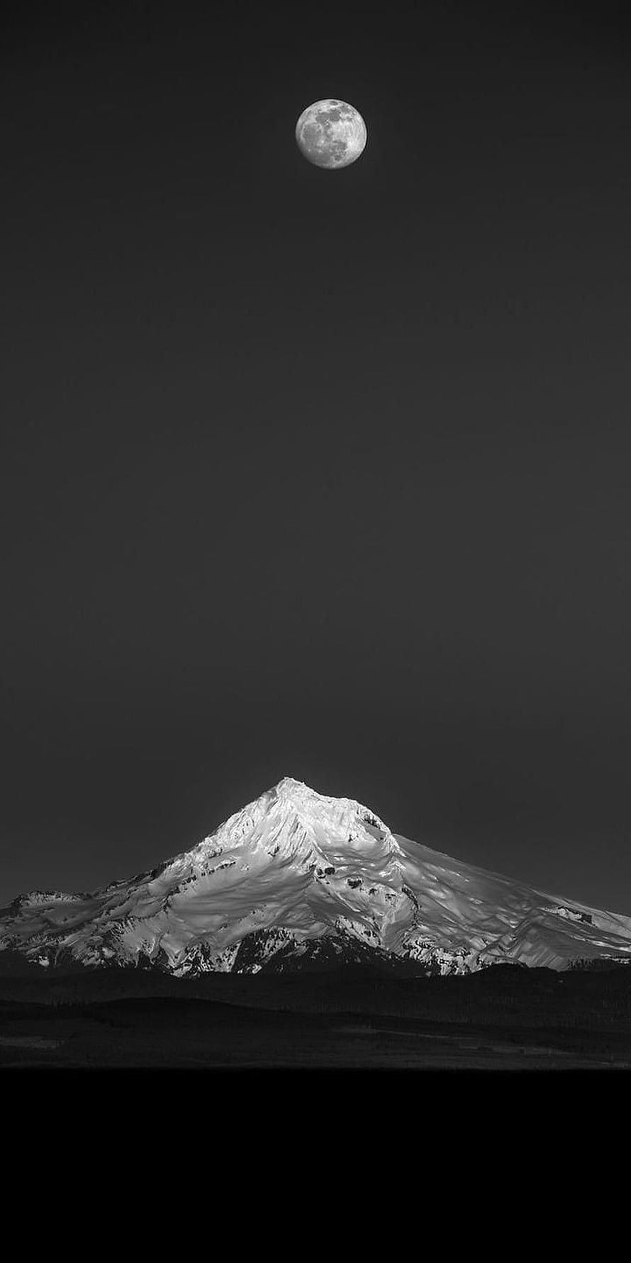 Monochrome Snow-Capped Mountain Peak Under a Full Moon in a Dark Night Sky HD phone wallpaper