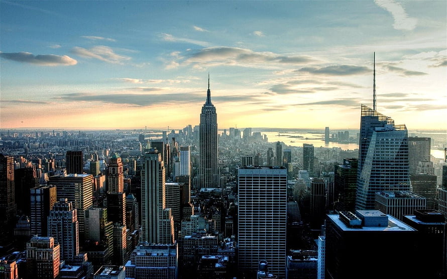 Aerial View of the New York City Skyline Featuring the Empire State Building at Golden Hour HD wallpaper