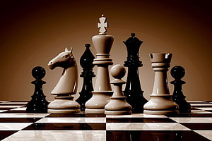 Elegant Chess Pieces Arranged on a Polished Board with Warm Studio Lighting HD wallpaper
