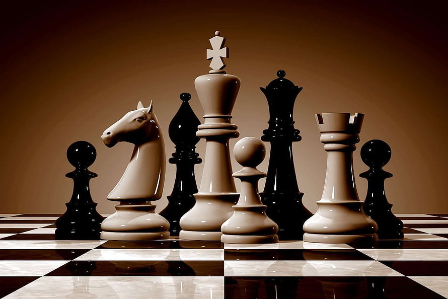 Elegant Chess Pieces Arranged on a Polished Board with Warm Studio Lighting HD wallpaper