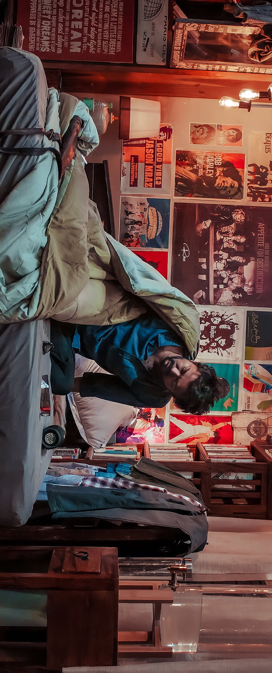 Vijay Thalapathy in a Cozy Bedroom with Vintage Music Posters and Warm Ambient Lighting HD phone wallpaper