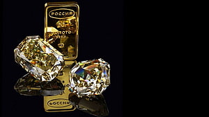 Luxury Gold Bars and Brilliant Diamonds on a Black Reflective Surface HD wallpaper