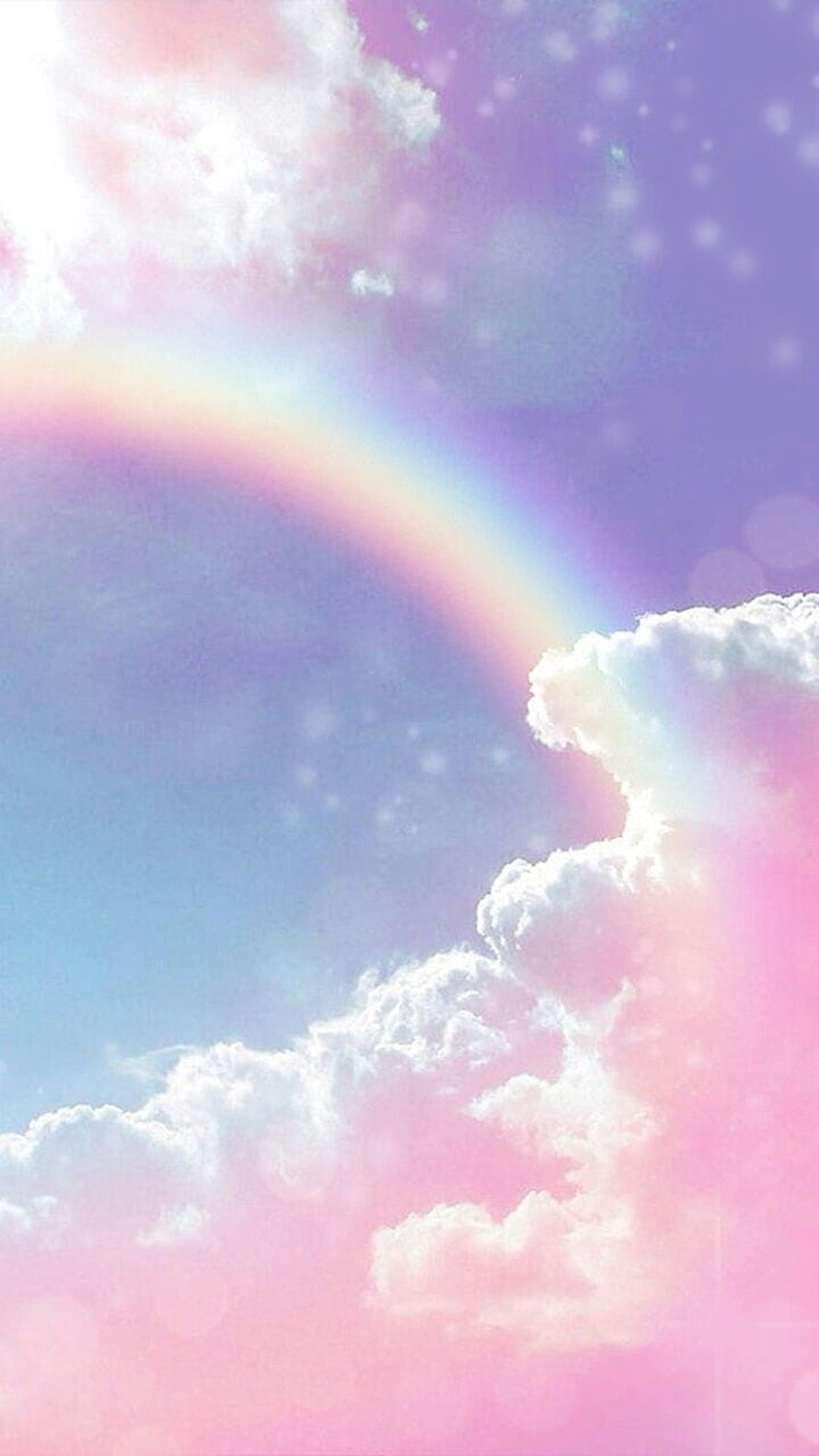 Dreamy pastel rainbow arching through soft pink and lavender clouds with bokeh light effects HD phone wallpaper