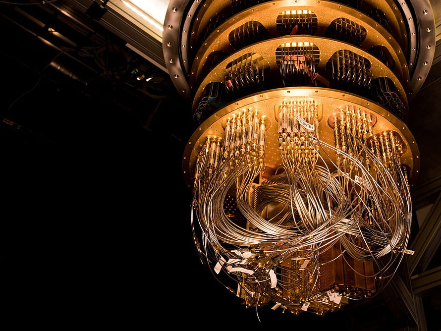 Close-up of a Quantum Computer Processor with Intricate Wiring and Gold Circuitry HD wallpaper